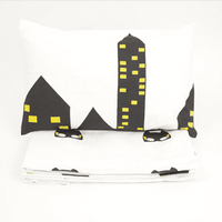 Cot Bedding Set – Ace the Superbaby Flies Over Town (Black)